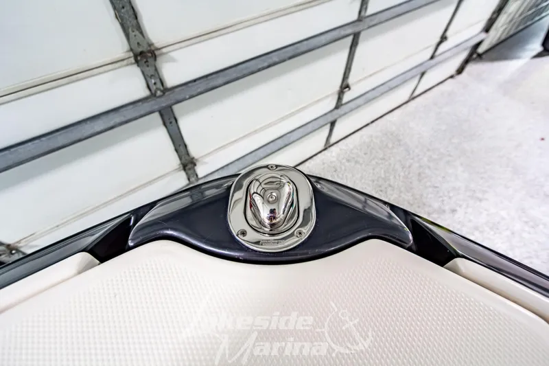 Slide: The Image of 2017 Chaparral 244 Sunesta boat detail in a garage setting. - 44