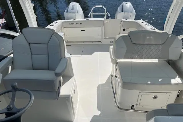 Slide: The Image of 2024 World Cat 280 DC-X boat interior with luxurious seating and dual engines. - 6