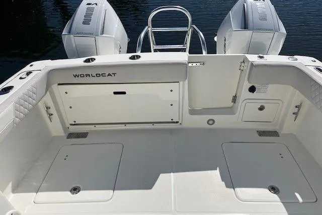 Slide: The Image of 2024 World Cat 280 DC-X boat deck with dual engines, spacious layout, and sleek design. - 7