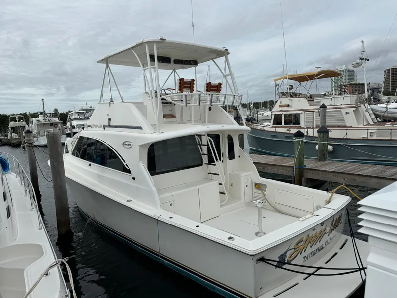Slide: The Image of 1997 Ocean Yachts 40 Super Sport docked at marina, rear view. - 2