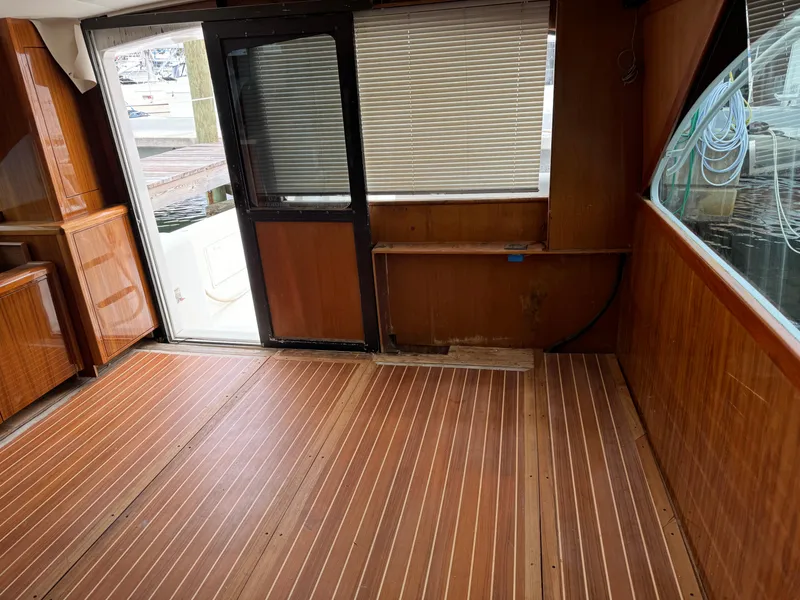 Slide: The Image of Interior of 1997 Ocean Yachts 40 Super Sport with wooden flooring and large windows. - 24