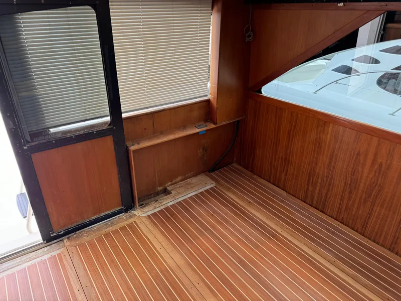 Slide: The Image of 1997 Ocean Yachts 40 Super Sport interior with wooden flooring and paneling. - 27