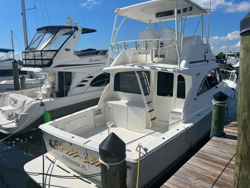 Slide: The Image of 1997 Ocean Yachts 40 Super Sport docked at marina on a sunny day. - 3