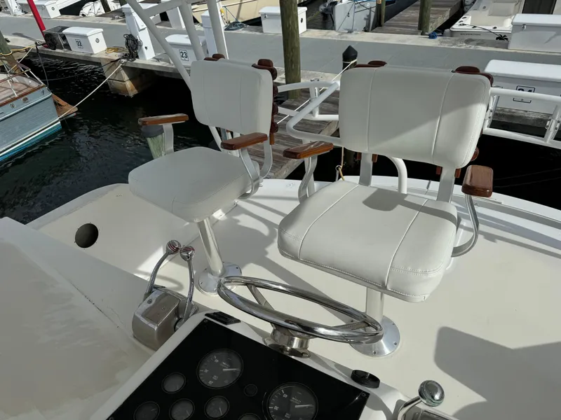 Slide: The Image of Captain's chairs on the 1997 Ocean Yachts 40 Super Sport at the marina. - 5