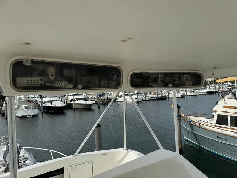 Slide: The Image of 1997 Ocean Yachts 40 Super Sport at marina, view from helm station. - 8