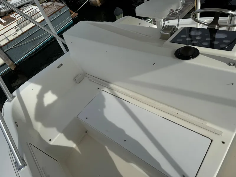 Slide: The Image of 1997 Ocean Yachts 40 Super Sport boat deck with seating and steering area. - 9