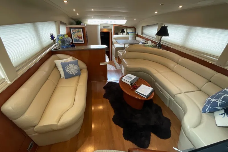 Slide: The Image of Luxurious interior of 2002 Sea Ray 480 Motor Yacht with plush seating and elegant decor. - 17