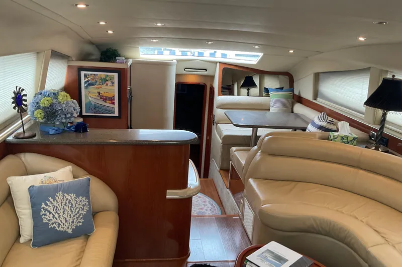 Slide: The Image of Luxurious interior of 2002 Sea Ray 480 Motor Yacht with elegant seating and decor. - 18