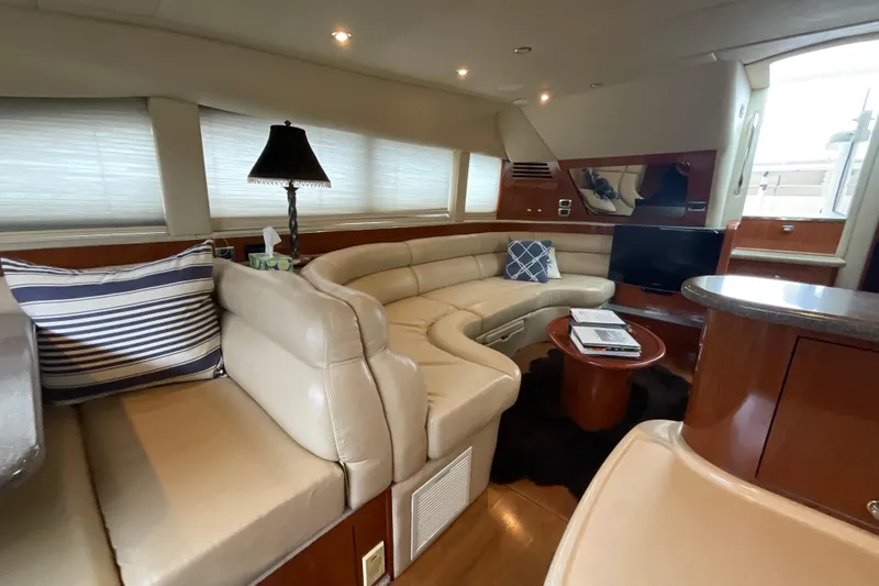 Slide: The Image of Luxurious interior of 2002 Sea Ray 480 Motor Yacht with plush seating and modern decor. - 19