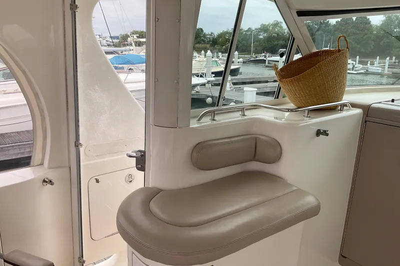 Slide: The Image of Interior of 2002 Sea Ray 480 Motor Yacht with seating and wicker basket. - 2