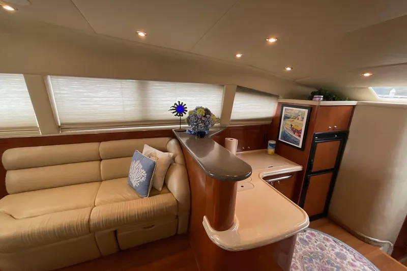 Slide: The Image of Luxurious interior of 2002 Sea Ray 480 Motor Yacht with elegant seating and modern amenities. - 20