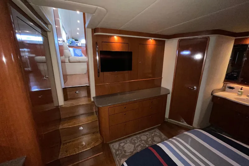 Slide: The Image of Interior of 2002 Sea Ray 480 Motor Yacht with wood cabinetry and modern amenities. - 27