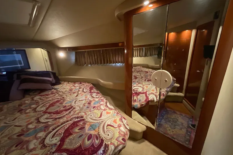 Slide: The Image of Luxurious bedroom interior of 2002 Sea Ray 480 Motor Yacht with mirrored closet. - 37