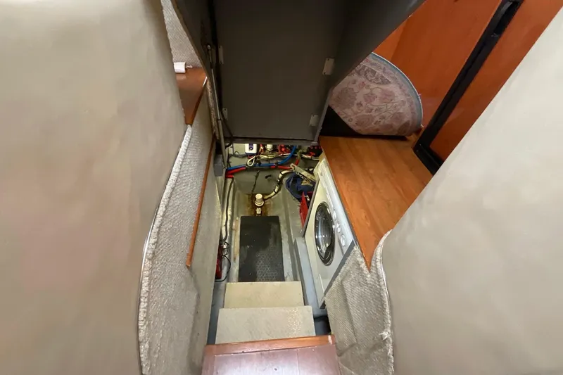 Slide: The Image of Interior view of 2002 Sea Ray 480 Motor Yacht with stairs and washing machine. - 45