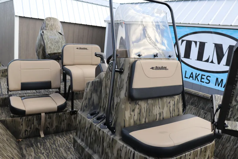 Slide: The Image of 2026 Sea Ark Phantom 20XV CC boat interior with camouflage design and seating. - 3