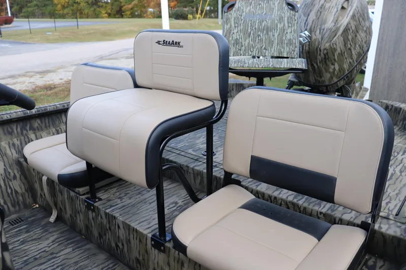 Slide: The Image of 2026 Sea Ark Phantom 20XV CC boat seats with camouflage design and beige upholstery. - 5
