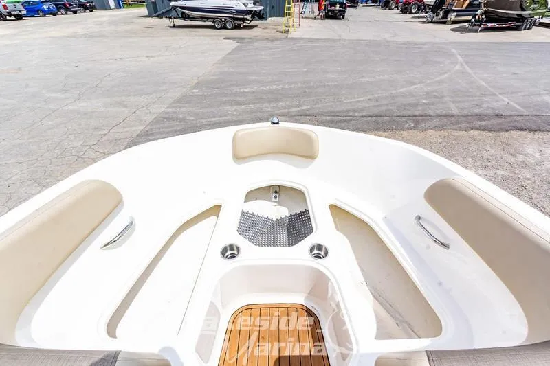 Slide: The Image of 2016 Bayliner VR6 Bowrider I/O boat interior with seating and cup holders. - 21
