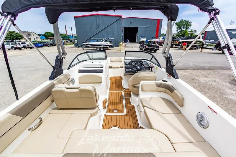 Slide: The Image of 2016 Bayliner VR6 Bowrider I/O with spacious seating and sleek design at a marina. - 26
