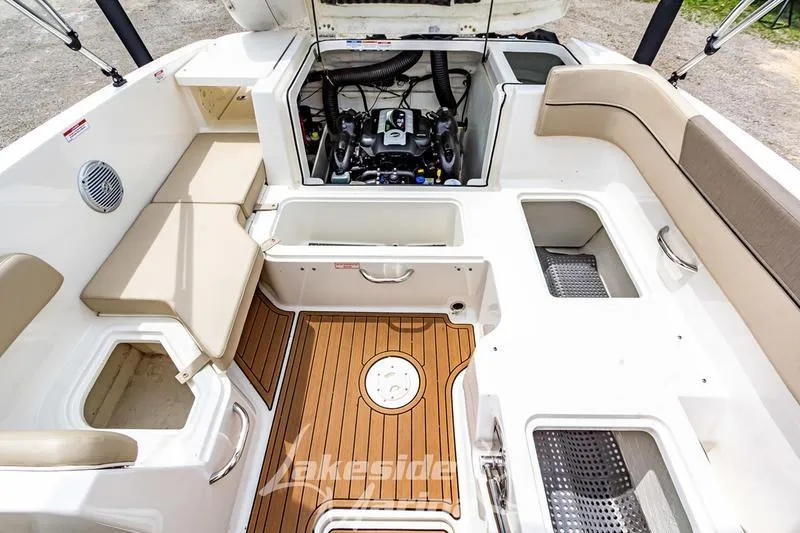 Slide: The Image of 2016 Bayliner VR6 Bowrider I/O interior with engine compartment and seating area. - 28