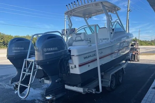 Slide: The Image of 2021 World Cat 230 DC boat with dual Yamaha engines on a trailer. - 3
