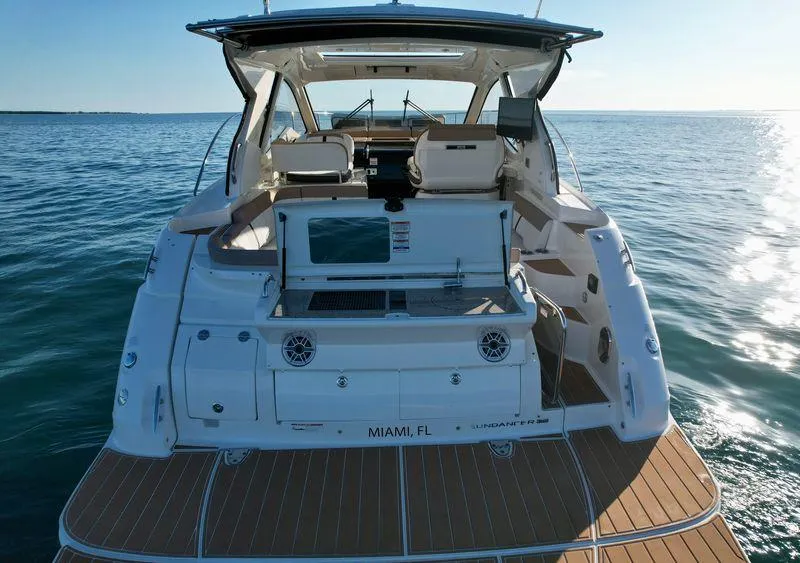 Slide: The Image of 2018 Sea Ray 350 DAC yacht on open water, rear view, Miami, FL. - 12