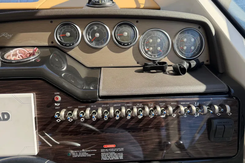 Slide: The Image of Control panel of a 2018 Sea Ray 350 Sundancer boat with gauges and switches. - 18