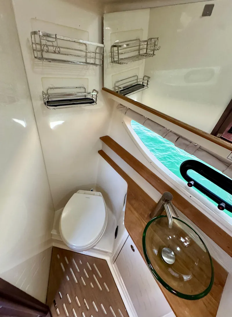 Slide: The Image of 2018 Sea Ray 350 DAC bathroom with modern fixtures and ocean view. - 29