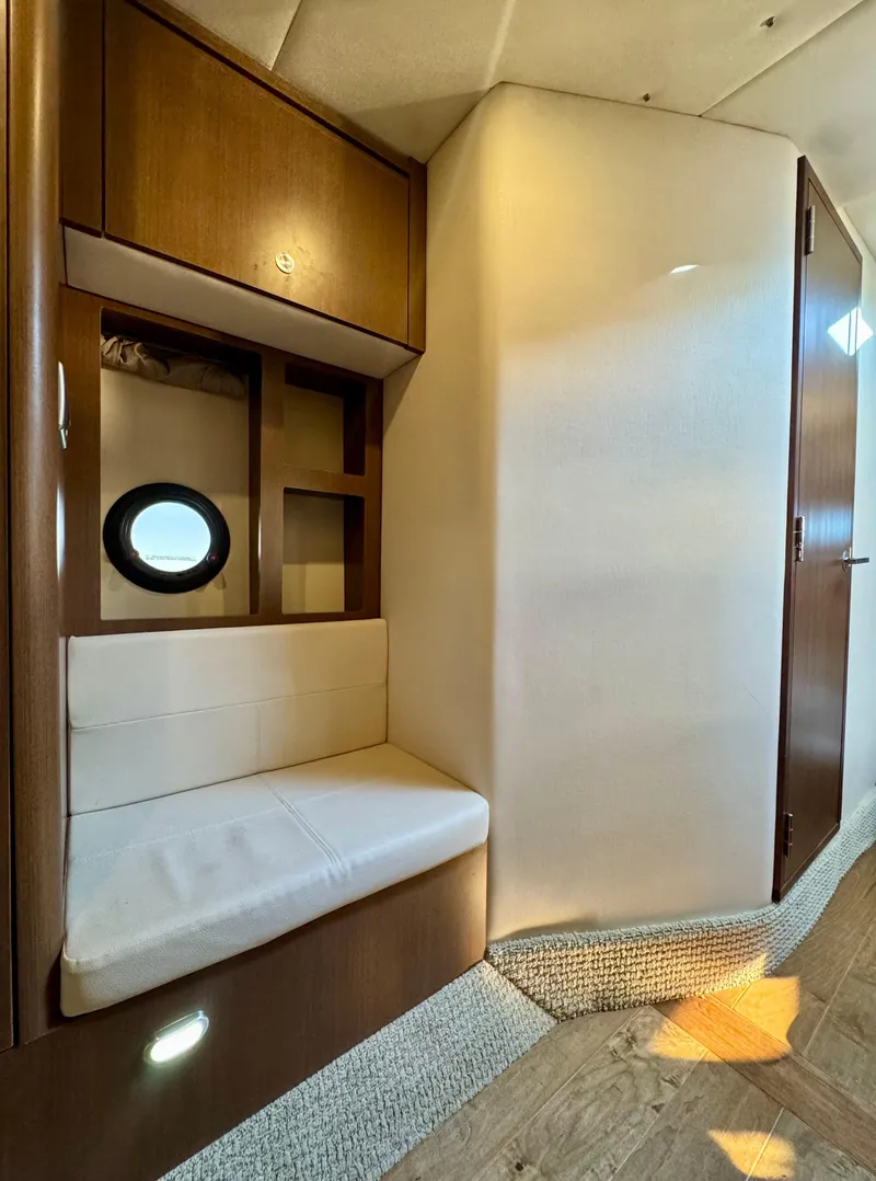 Slide: The Image of Interior of 2018 Sea Ray 350 DAC yacht with seating and porthole. - 30