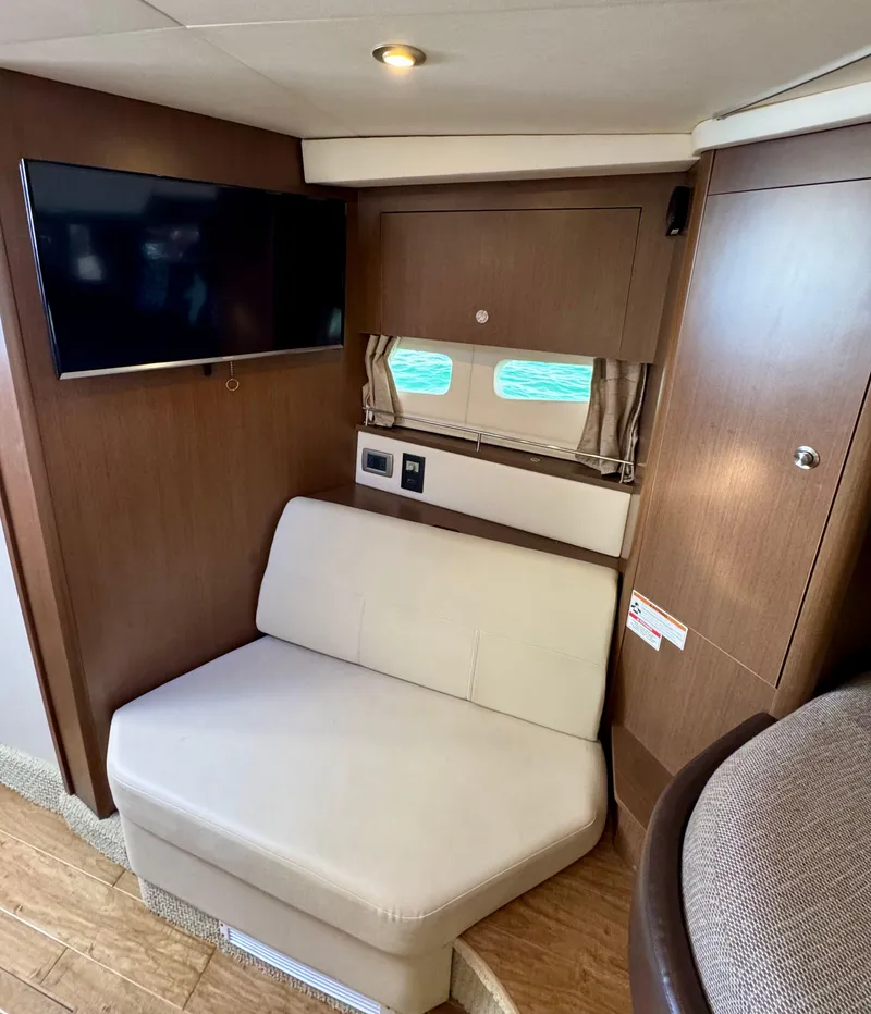 Slide: The Image of Interior of 2018 Sea Ray 350 DAC yacht with seating and TV. - 36