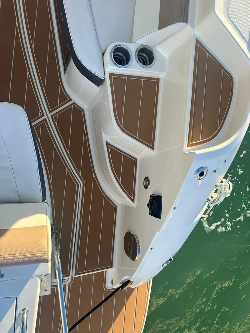 Slide: The Image of 2018 Sea Ray 350 DAC boat deck with brown and white design. - 39