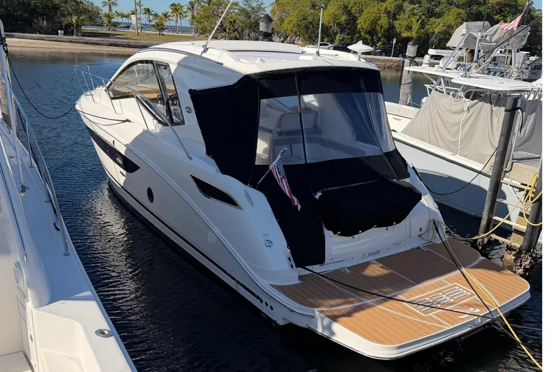 Slide: The Image of 2018 Sea Ray 350 Sundancer docked at a marina. - 47