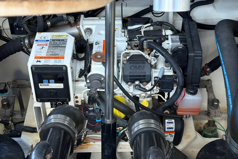 Slide: The Image of Engine compartment of a 2018 Sea Ray 350 Sundancer with Kohler generator. - 52