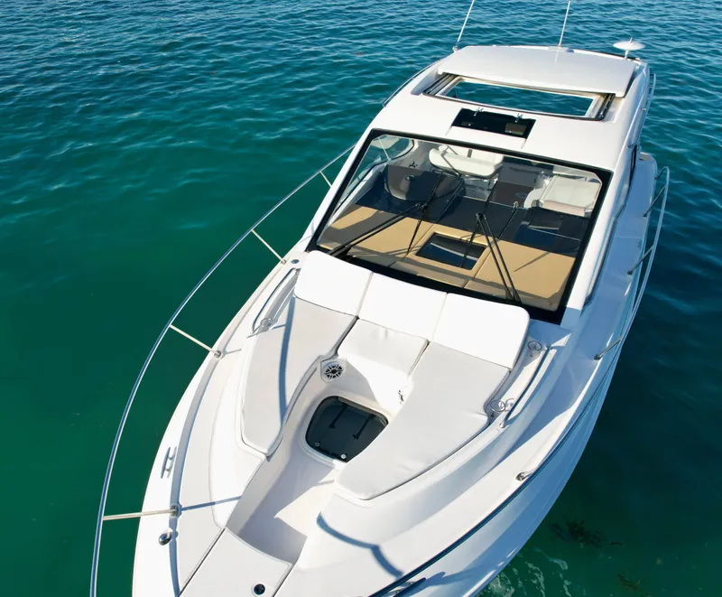 Slide: The Image of 2018 Sea Ray 350 DAC boat on clear blue water, top view. - 6