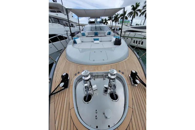 Slide: The Image of Luxurious 2020 Mangusta 110 Open yacht deck with city skyline view. - 12