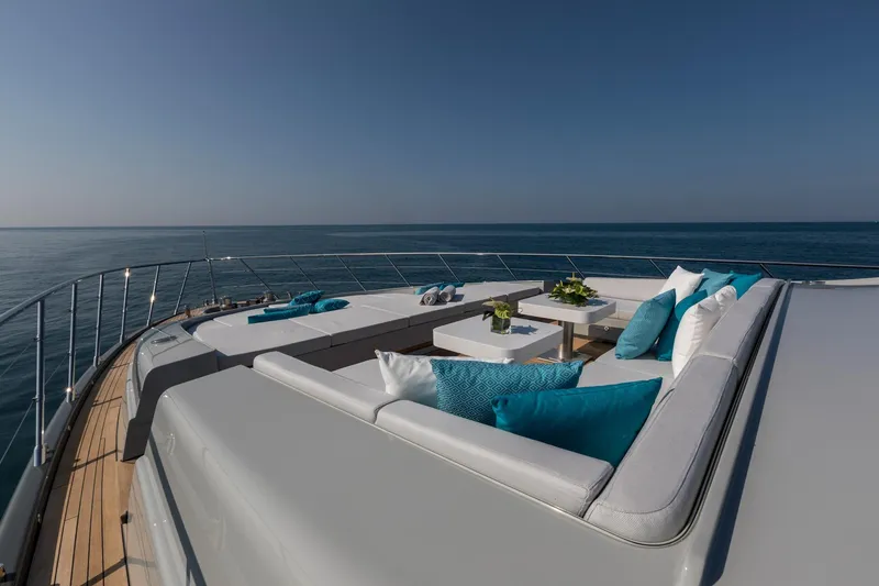 Slide: The Image of Luxury 2020 Mangusta 110 Open yacht cruising near city skyline. - 4