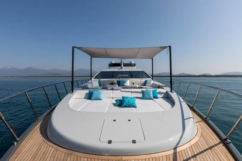 Slide: The Image of Luxurious 2020 Mangusta 110 Open yacht cruising near city skyline. - 5