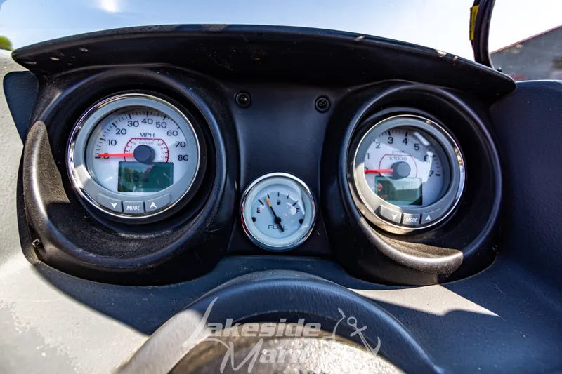 Slide: The Image of Dashboard of 2016 Lund 1675 Impact XS SS boat with speedometer and fuel gauge. - 21