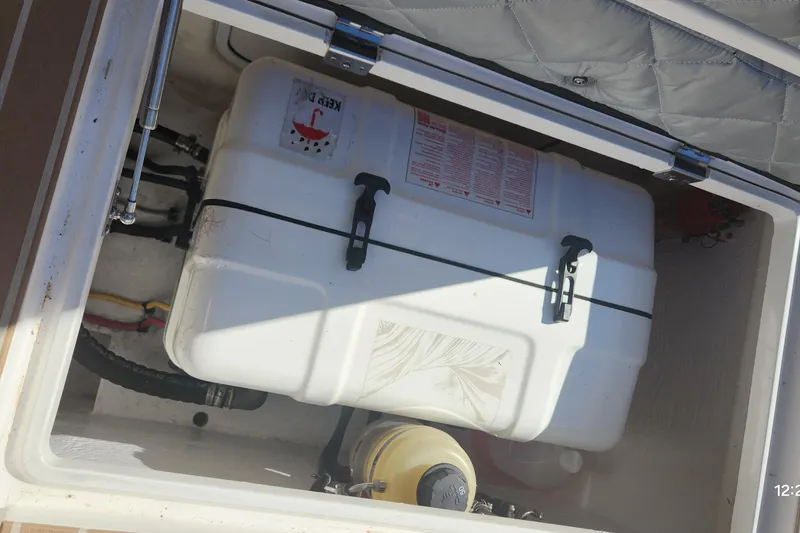 Slide: The Image of Storage compartment of a 2017 Intrepid 475 Sport Yacht with equipment and containers. - 15