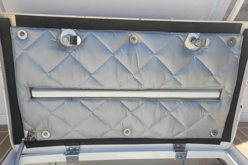 Slide: The Image of Quilted interior panel of 2017 Intrepid 475 Sport Yacht with metal fixtures. - 16