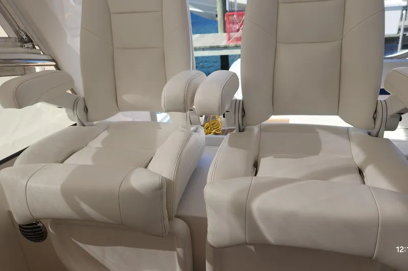 Slide: The Image of Luxury white seats on a 2017 Intrepid 475 Sport Yacht. - 19