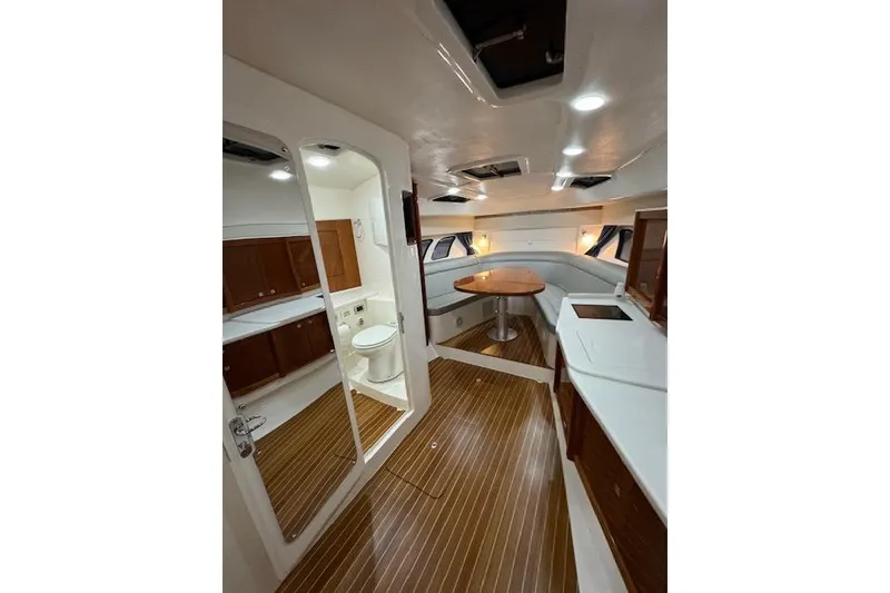 Slide: The Image of Luxurious interior of 2017 Intrepid 475 Sport Yacht with wood flooring and modern amenities. - 22
