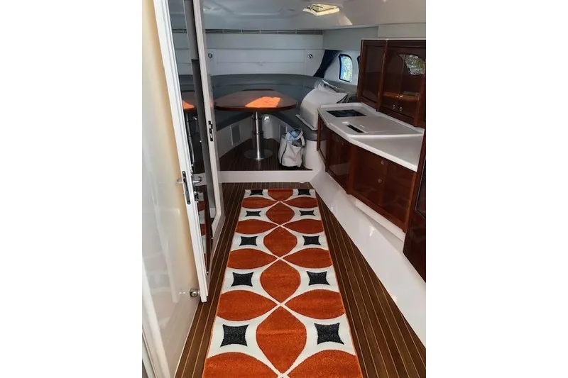 Slide: The Image of Interior of 2017 Intrepid 475 Sport Yacht with modern design and vibrant rug. - 23