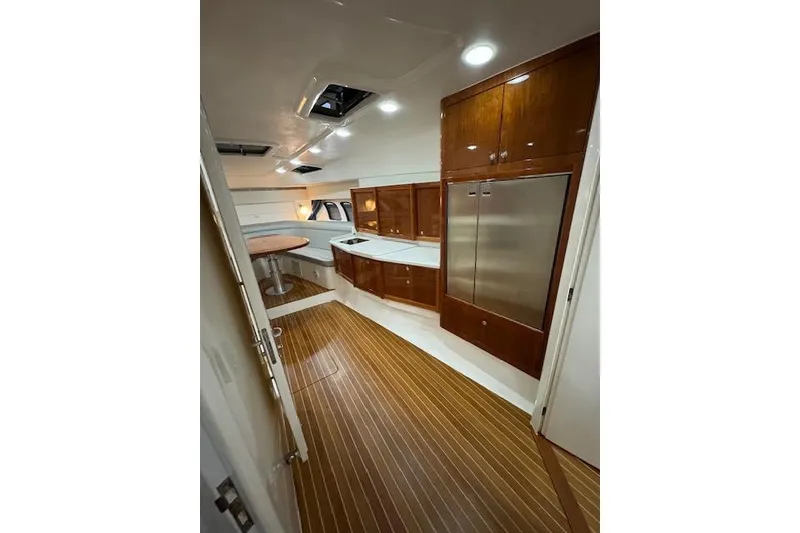 Slide: The Image of Luxurious interior of 2017 Intrepid 475 Sport Yacht with wood flooring and modern cabinetry. - 24