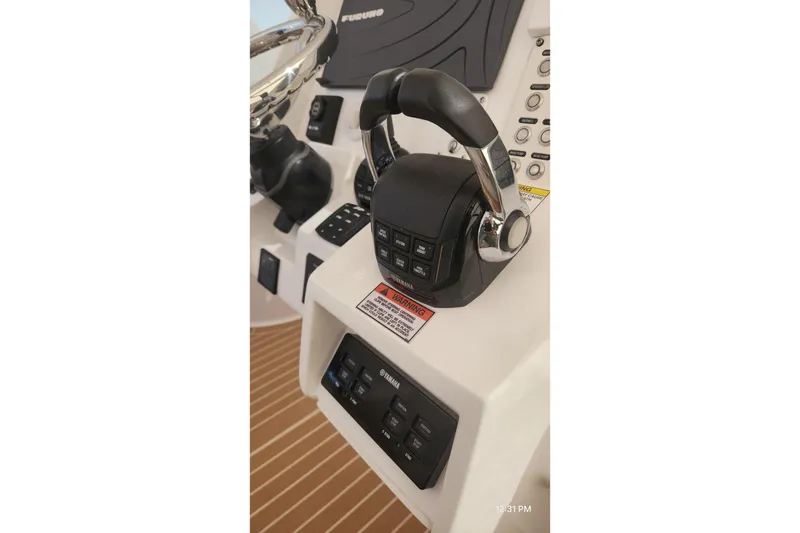 Slide: The Image of Control panel of a 2017 Intrepid 475 Sport Yacht with Yamaha throttle. - 32