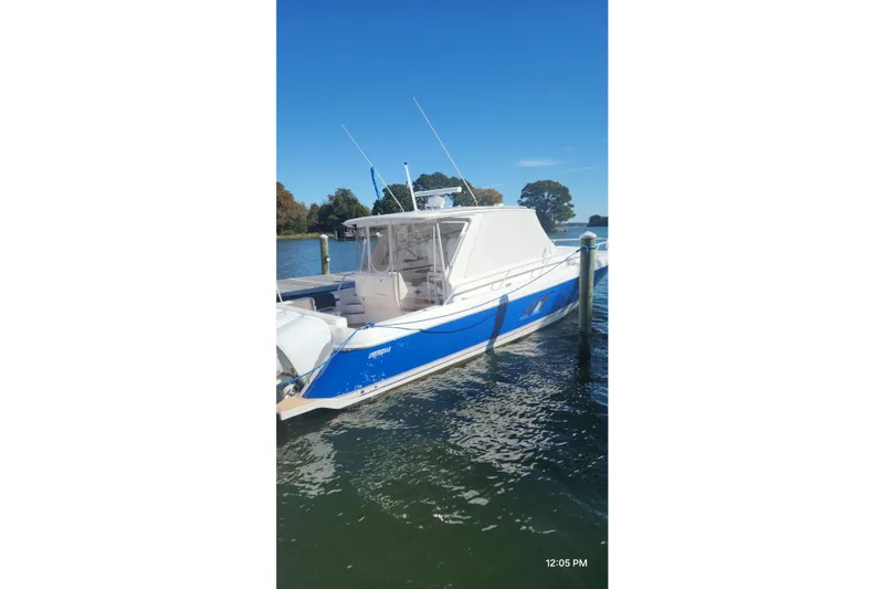 Slide: The Image of 2017 Intrepid 475 Sport Yacht docked on a sunny day. - 4