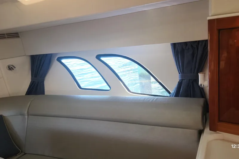 Slide: The Image of Interior of 2017 Intrepid 475 Sport Yacht with ocean view through windows. - 40