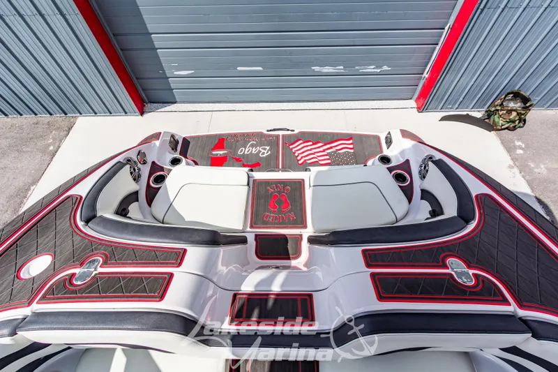Slide: The Image of 2016 Yamaha Boats 242 Limited S E-Series interior with custom red and black seating. - 12