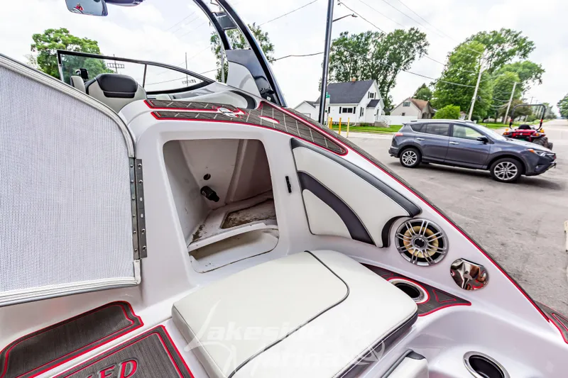 Slide: The Image of 2016 Yamaha Boats 242 Limited S E-Series interior with seating and speaker detail. - 13