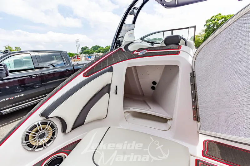 Slide: The Image of 2016 Yamaha Boats 242 Limited S E-Series interior with storage compartment and speaker. - 14