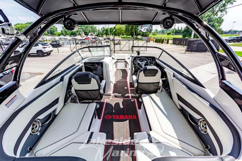 Slide: The Image of 2016 Yamaha Boats 242 Limited S E-Series interior with sleek seating and modern dashboard. - 16